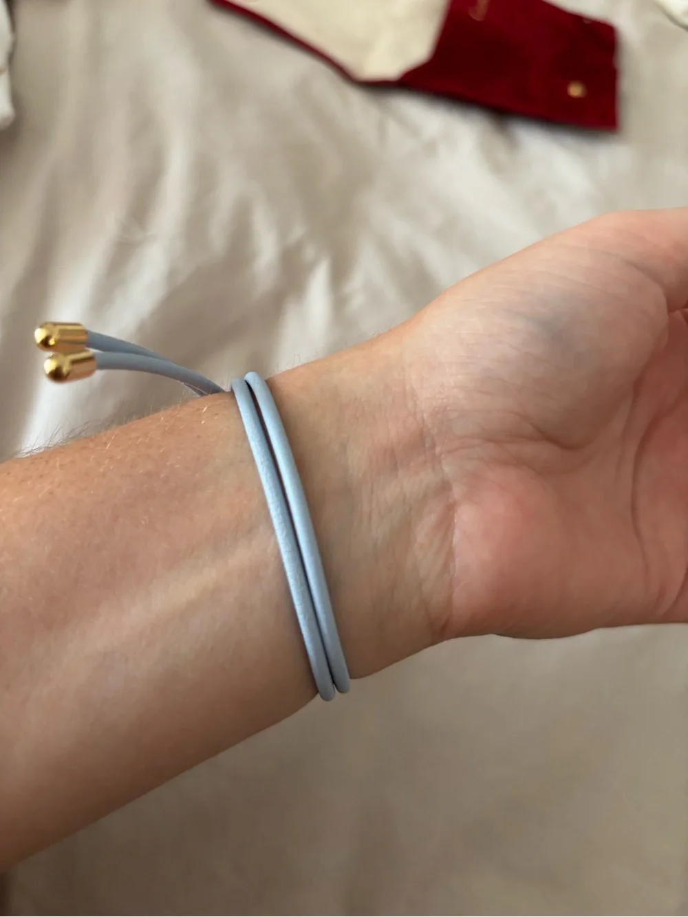 Louis Vuitton Light Blue Leather Cord Bracelet with Gold LV Charm